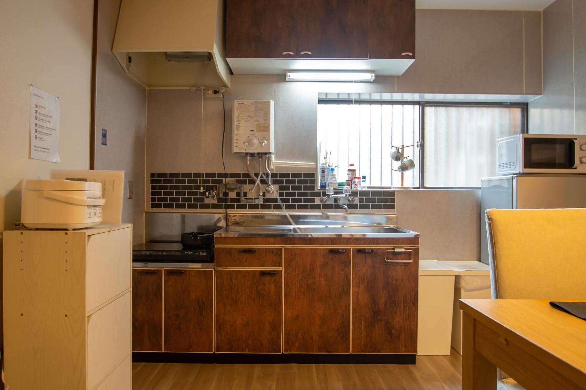 ｕｓｊ,万博,梅田への交通抜群,ファミリーで安心のguesthouse-泉- Apartamento Osaka